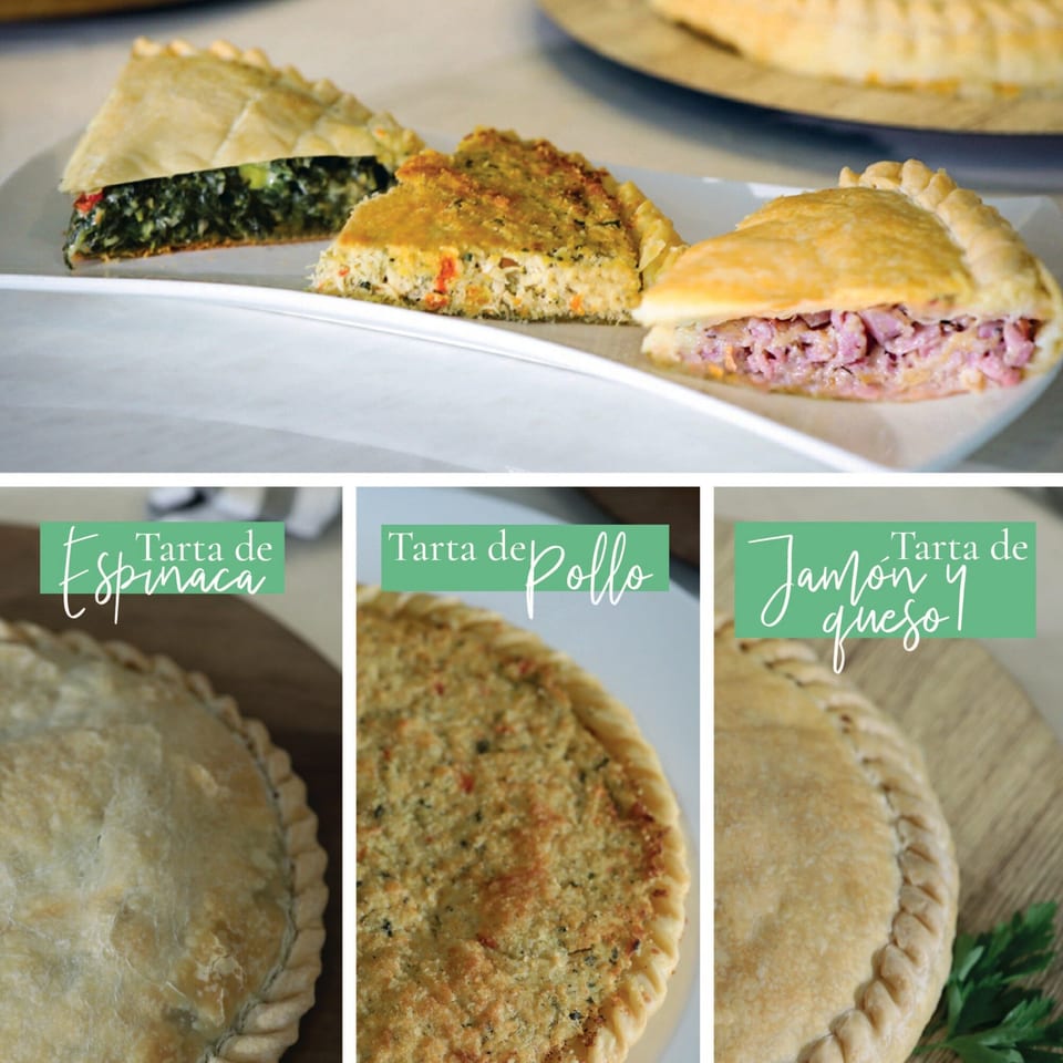 Slices of Argentinian spinach tart, chicken tart, and ham and cheese empanada on a white plate.